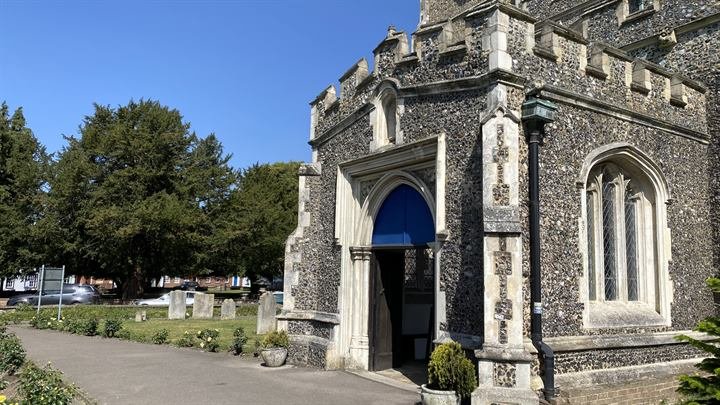 The south porch entrance of St Mary's with its blue door